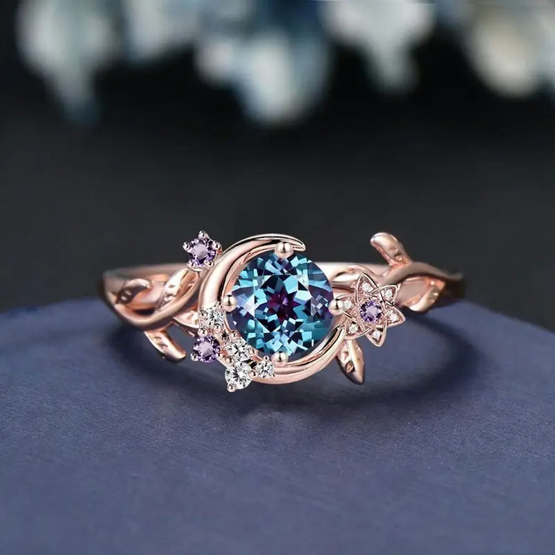 Bague dorée lune et motifs végétaux avec zircons