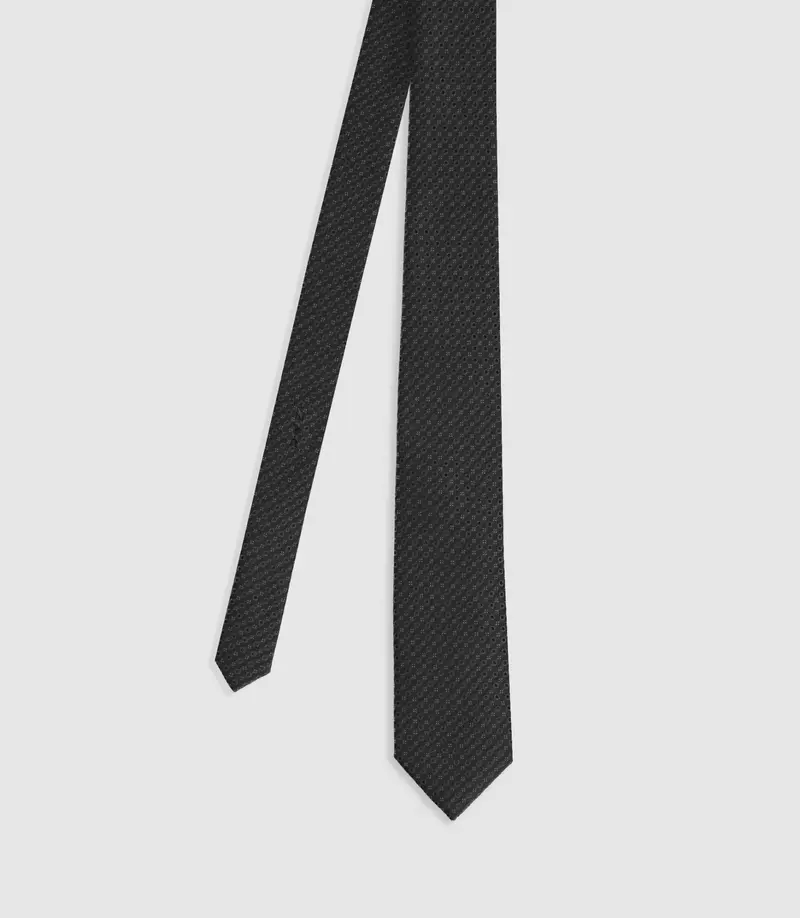 Cravate à motifs en soie noire