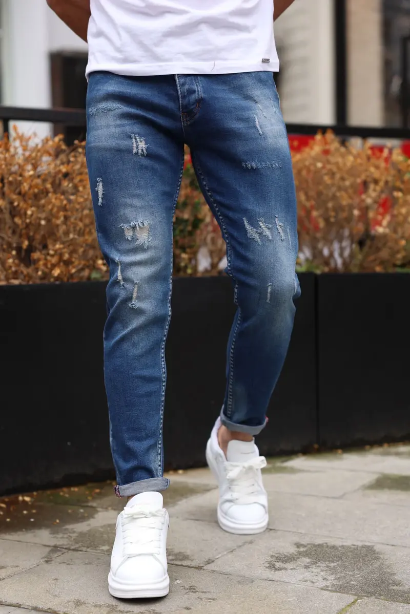 Jean bleu foncé slim effet déchiré