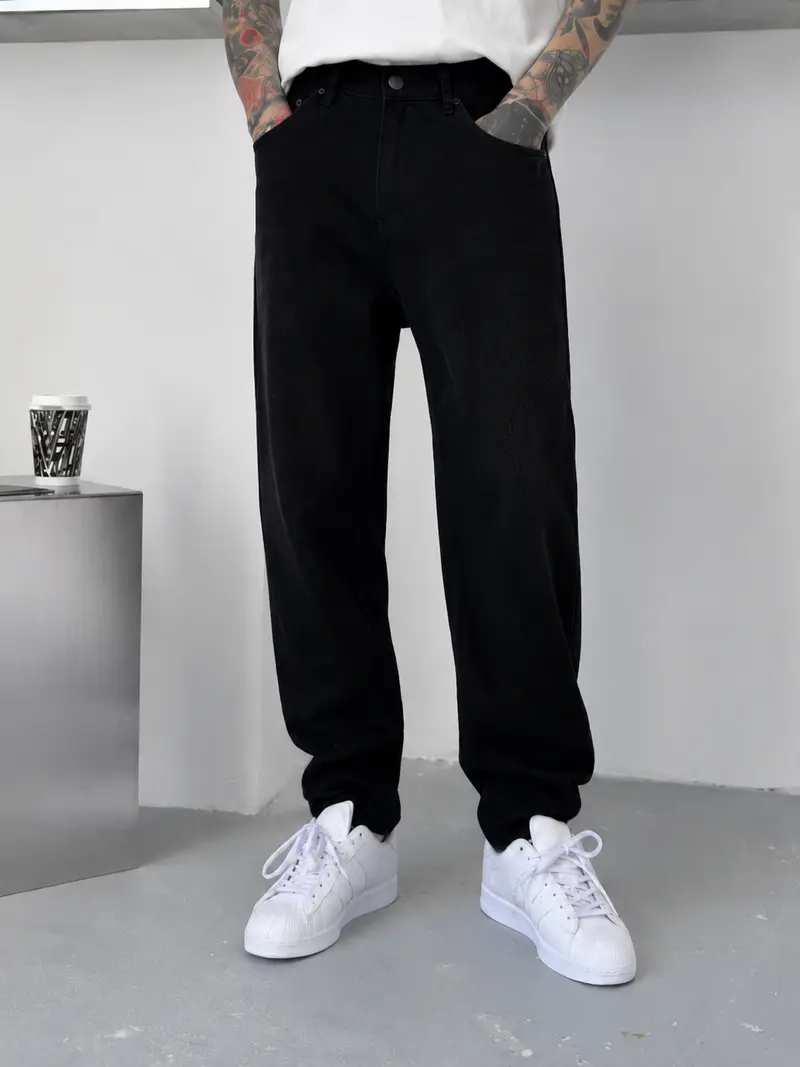 Jean homme noir coupe large délavé