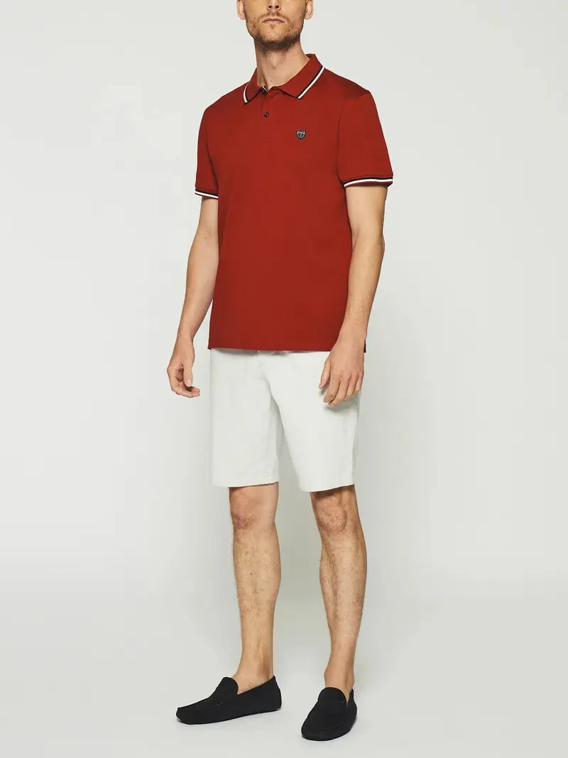 Polo uni avec broderie rouge GILLES