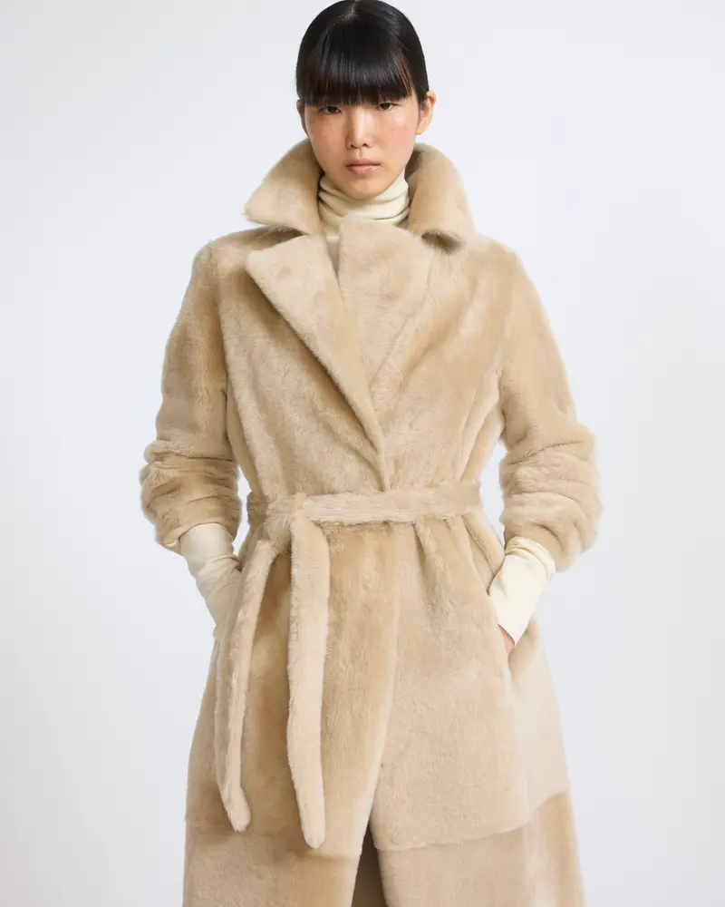 Reversible belted long shearling coat