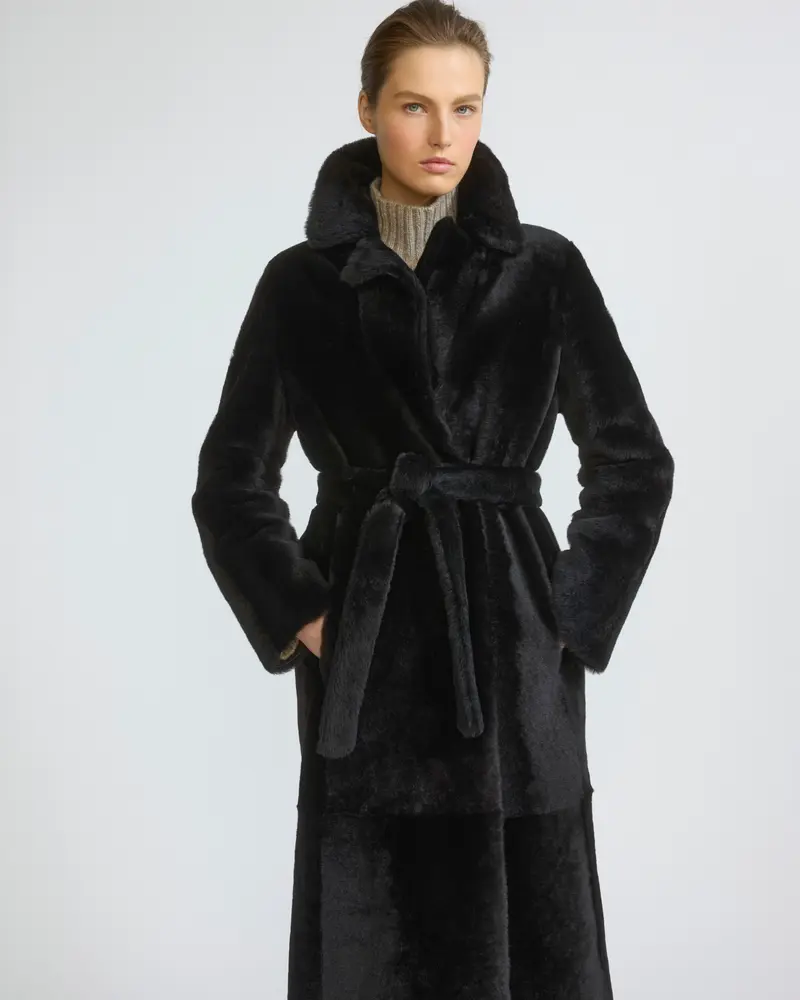 Reversible belted long shearling coat