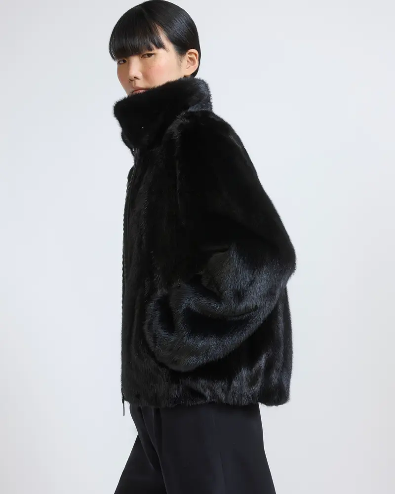 Reversible water-repellent technical fabric bomber with mink fur